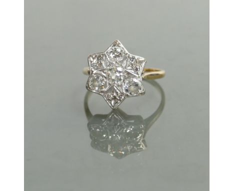 18ct diamond cluster ladies ring: The four main diamonds approx .20pts each &amp; 4mm wide, size N, 3.6 grams.