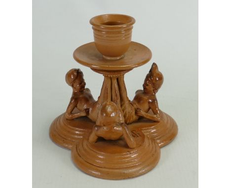 Rare Doulton Lambeth Tinworth candlestick: A Stoneware candlestick modelled as three seated children who's legs form the stem