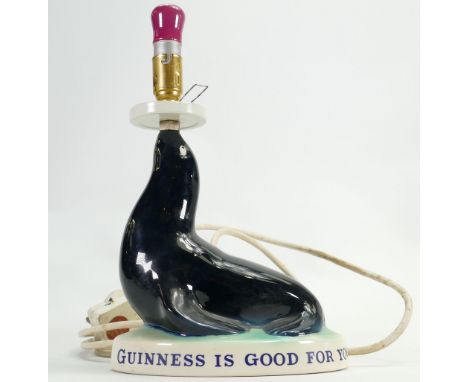 Carltonware Advertising Guinness lamp base: As a seal on a base.