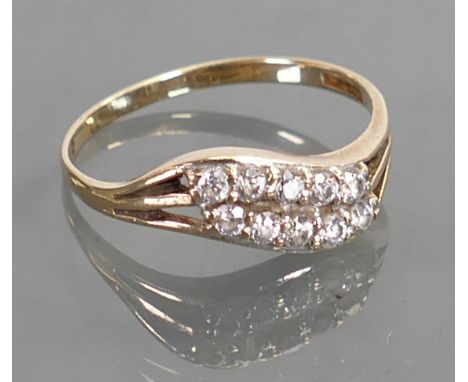 9ct gold ring set with ten diamonds: Size P/Q,1.6 grams.