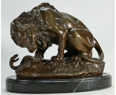 Reproduction Bronze figure of a Lion &amp; Snake: Mounted on black marble base, height 22cm.