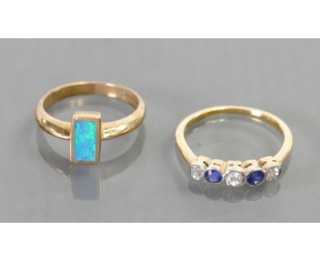 9ct gold ladies ring set with opal stone and another yellow metal ladies ring set with semi precious stones: 6.1 grams. (2)