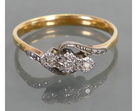 Ladies yellow metal diamond ring: Set with 3 stones, tested to be 18ct, 3.8 grams.