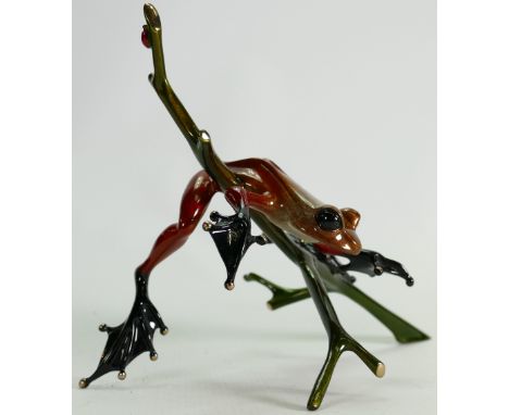 Tim Cotterill "Frogman" bronze frog sculpture: Brightly coloured frog on branch, limited edition 2008, h 17 x 31cm.