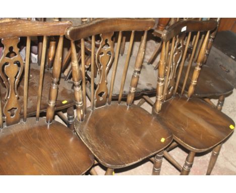 A SET OF SIX OAK STICK BACK DINING ROOM CHAIRS