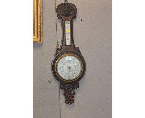 AN OAK ANEROID BAROMETER