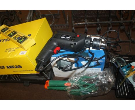 A SELECTION OF TOOLS AND A PAIR OF WORK BOOTS