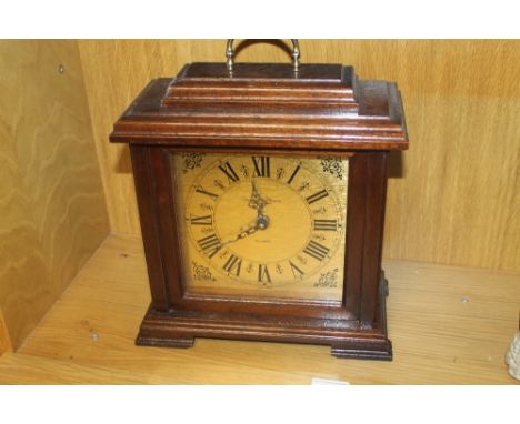 A LARGE MANTEL CLOCK