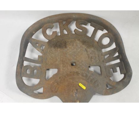 A BLACKSTONE CAST IRON TRACTOR SEAT