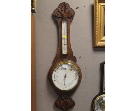 AN OAK ANEROID BAROMETER