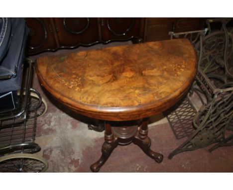 A WALNUT FOLD OVER CARD TABLE