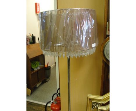 A medium standard lamp with crystal droplets