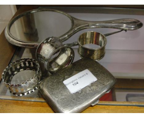 A HM silver cigarette case; together with a HM silver mirror, button hook and three napkin rings