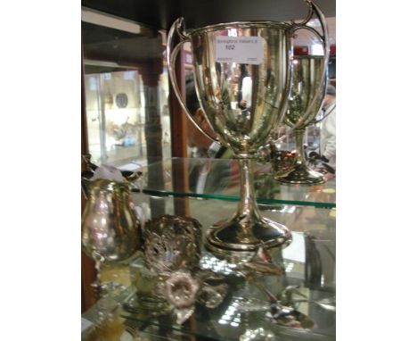 Six HM silver items; boat, trophy, spoon, cup holder, creamer and teapot finial