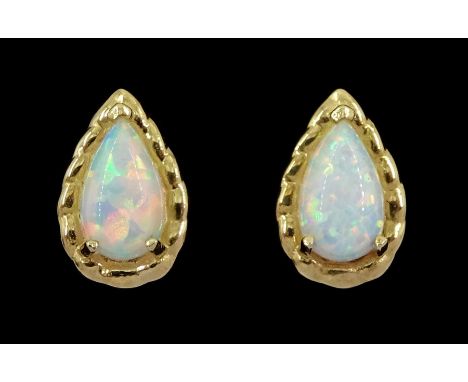 Pair of 9ct gold pear opal stud earrings, stampedCondition Report:Approx 0.45gm, length = 8mm, good condition