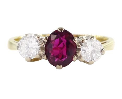 18ct gold three stone oval cut ruby and round brilliant cut diamond ring, London 1979, ruby approx 0.50 carat, total diamond 