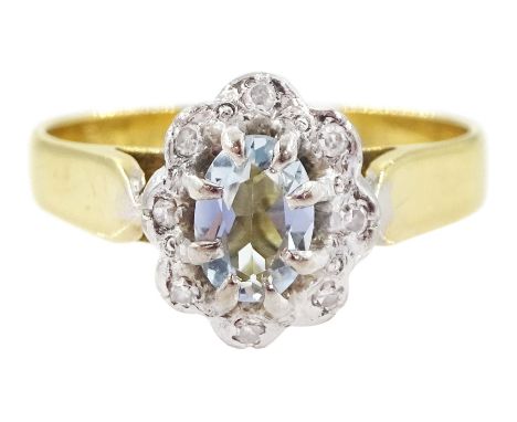 18ct gold oval cut aquamarine and round brilliant cut diamond cluster ring, London 1972Condition Report:Approx 3.6gm, size M-