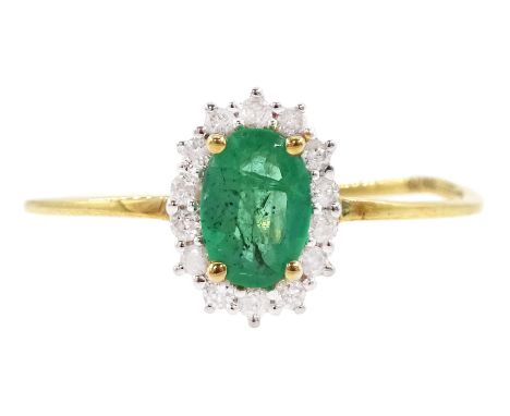 18ct gold oval cut emerald and round brilliant cut diamond cluster ring, stamped 750Condition Report:Approx 1.4gm, size N, ov