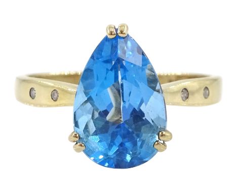 9ct gold single stone pear cut Swiss blue topaz ring, with diamond set shoulders, hallmarkedCondition Report:Approx 2.9gm, si