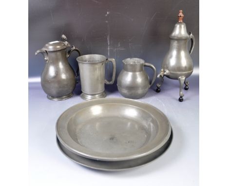 A collection of antique pewter dating from the 19th Century to include a tall Continental coffee pot samovar with wooden fini