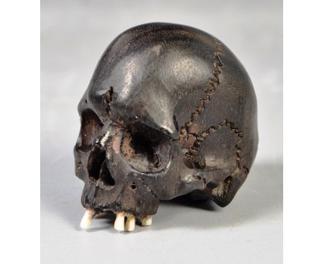 An antique 19th Century Japanese&nbsp;Oriental Meiji period Memento Mori Vanitas ebonised carved netsuke in the form of a hum