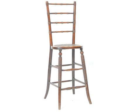 An early 19th Century Georgian Regency period mahogany childs childrens correctional chair / deportment chair of tall and thi