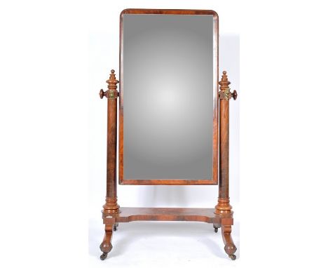 An antique 19th Century Victorian English mahogany&nbsp;cheval dressing mirror having a large central mirror panel with mahog