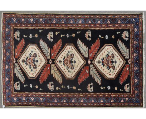 An antique 20th Century&nbsp;Persian Islamic handmade wool rug / floor carpet / runner of elongated form. The carpet having b