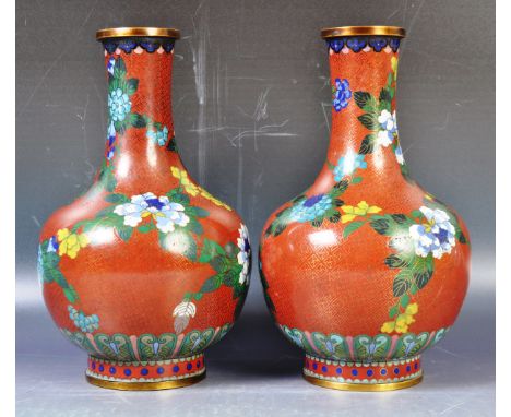 A pair of antique early 20th Century Japanese Meiji period cloisonne vases of mallet form having tapered necks with globular 
