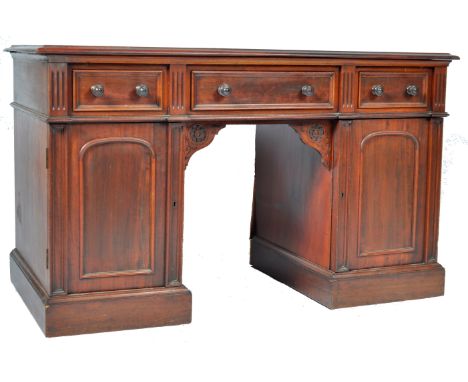 An antique late 19th / early 20th Century Victorian / Edwardian mahogany twin pedestal writing table desk in the manner of Gi