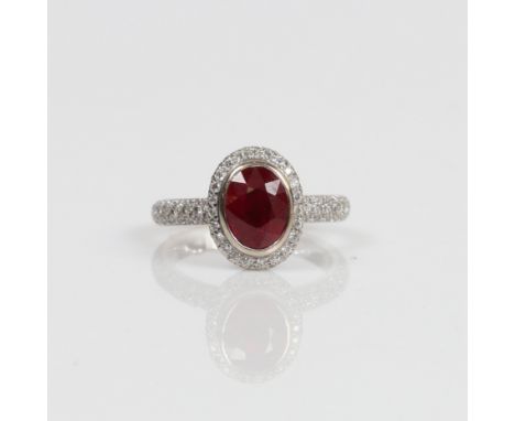 THEO FENNELL RUBY AND DIAMOND CRADLE RING. One oval mixed cut ruby approx. 2.04ct. Bezel set with pavé diamond halo, gallery 