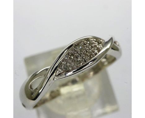 9ct white gold crossover ring set with diamonds, size O, 2.2g. UK P&amp;P Group 1 (£16+VAT for the first lot and £2+VAT for s