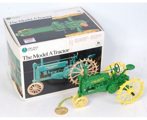 An ERTL Precision Classics No. 560 1/16 scale model of a John Deere model A tractor, appears as issued in the original polyst