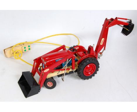 A Cragstan of the USA tinplate and battery operated model of a Ford 4000 diesel industrial tractor fitted with rear bucket sc