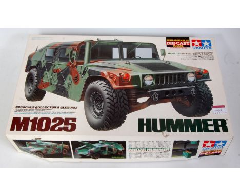 A Tamiya 1/20 scale semi-assembled diecast model kit for an M1025 Hummer, all appears as issued in the original plastic packe