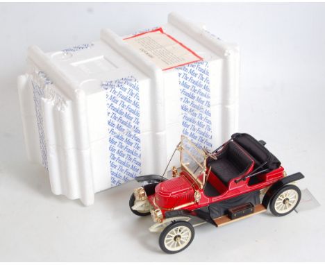 A Franklin Mint 1/24 scale boxed and polystyrene packed diecast group to include a 1915 Stutz Beercat, a 1912 Packard Victori