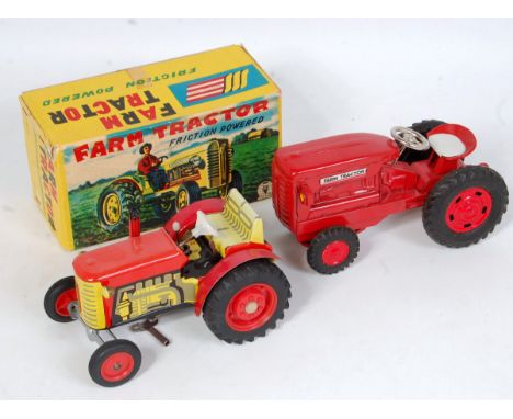 An SSS Toys of Japan tinplate and friction powered model farm tractor, model No. S-1207 finished in red with black rubber tyr