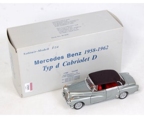 A CMC Exclusive Models 1/24 scale No. M-026 model of a Mercedes Benz 1958-1962 Cabriolet type D, finished in silver with red 