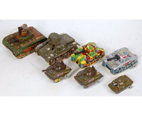 Seven various loose tinplate, clockwork and friction drive model tanks, to include a Bandai of Japan M-58 with driver figure 