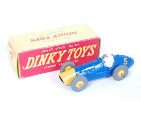 A Dinky Toys No. 234 Ferrari racing car comprising of blue body with yellow nose cone and cast yellow hubs, racing No. 5, wit