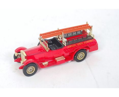 A Matchbox Models of Yesteryear Y7 1920 Rolls Royce fire engine comprising of bright red body with black interior and tan lad