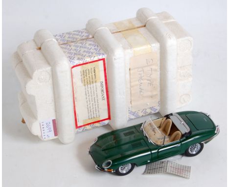 A Franklin Mint 1/24 scale polystyrene packed and boxed diecast group, three examples to include a 1961 Jaguar E-type, a 1988