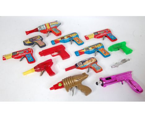 12 various tinplate and plastic Space Friction Powered Rayguns, examples to include a Haji friction powered atomic gun, 2x Ja