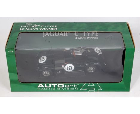 An Auto Art Racing Division Model No. 85387 1/18 scale model of a Jaguar C-type 1953 Le Mans winner racing car, finished in d
