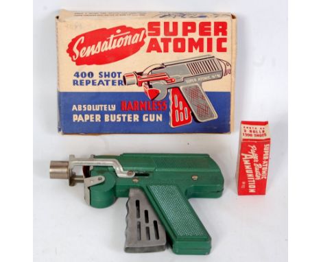 A Sensational Super Atomic No. 91 400 shop repeater paper buster gun comprising green and silver body with original box, and 