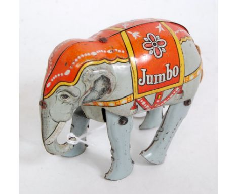 A Blomer &amp; Schuler German tinplate and clockwork model of a Jumbo elephant, comprising light grey body with original fabr