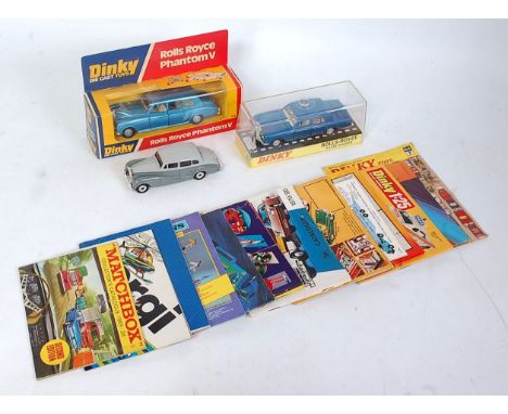 A Dinky Toys boxed loose diecast group also sold with a selection of various model catalogues to include a Dinky Toys No. 158