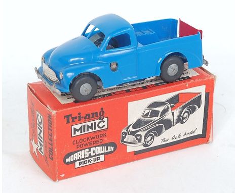 A Triang post-war Morris Cowley pickup comprising blue plastic body with cast hubs and red tail gate, housed in the original 