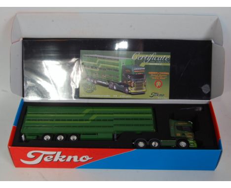 A Tekno 1/50 scale boxed model of a Thompson of Sauchen Scania R580 tractor unit and livestock trailer, appears complete in t