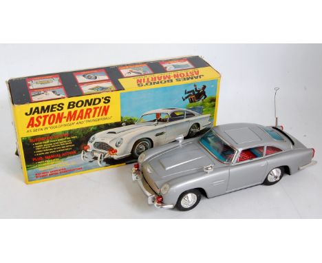 Gilbert "James Bond" Tinplate Aston Martin DB5 "Goldfinger/Thunderball", battery operated finished in Silver, Chrome trim wit